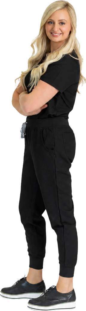 Brittany Ptachick, MSN, FNP-C, founder and nurse practitioner at Colonial Aesthetics & Wellness in Williamsburg, Virginia, in black scrubs