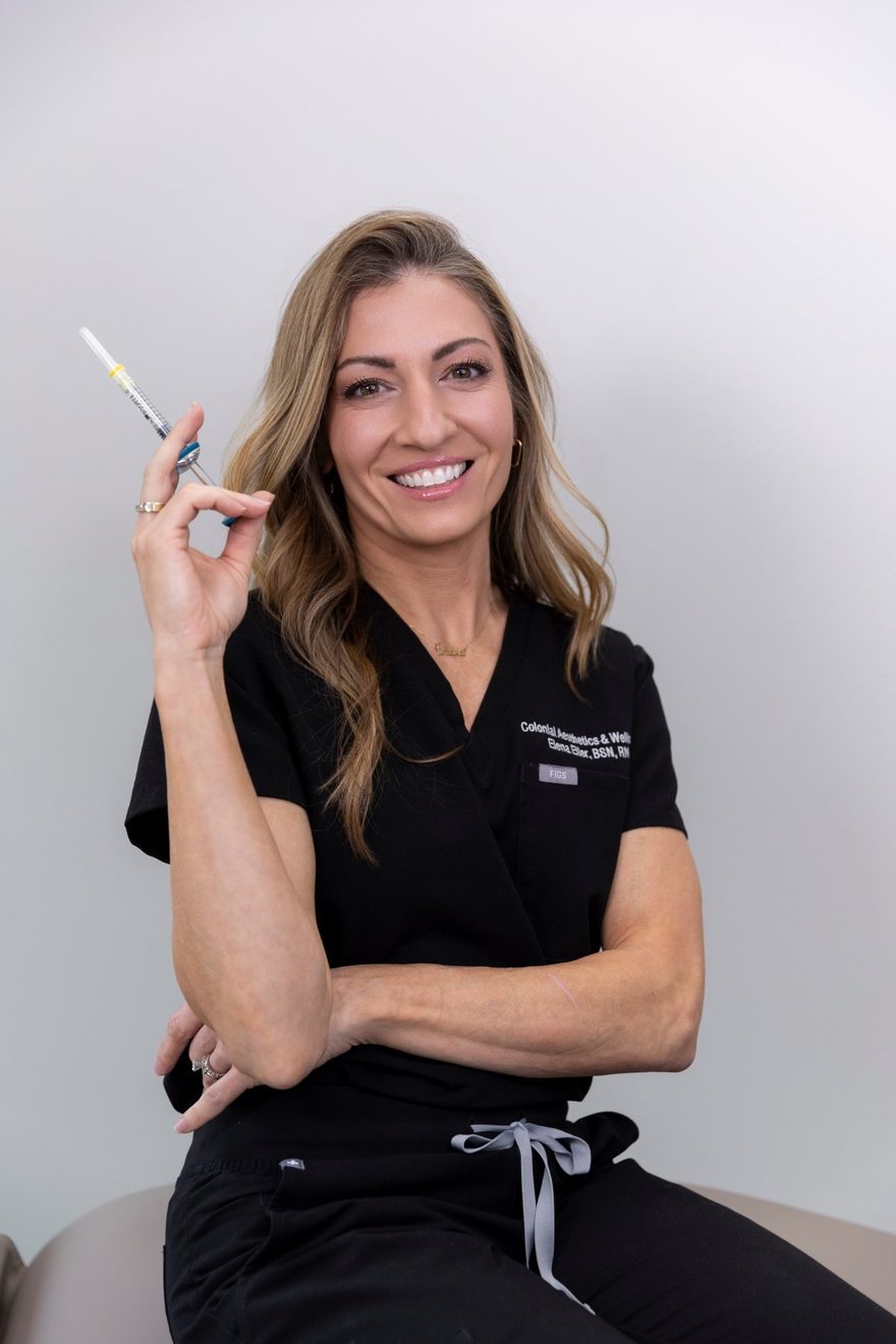 Portrait of Elena Eller, BSN, RN — Aesthetic Nurse at Colonial Aesthetics & Wellness, holding an injectable syringe