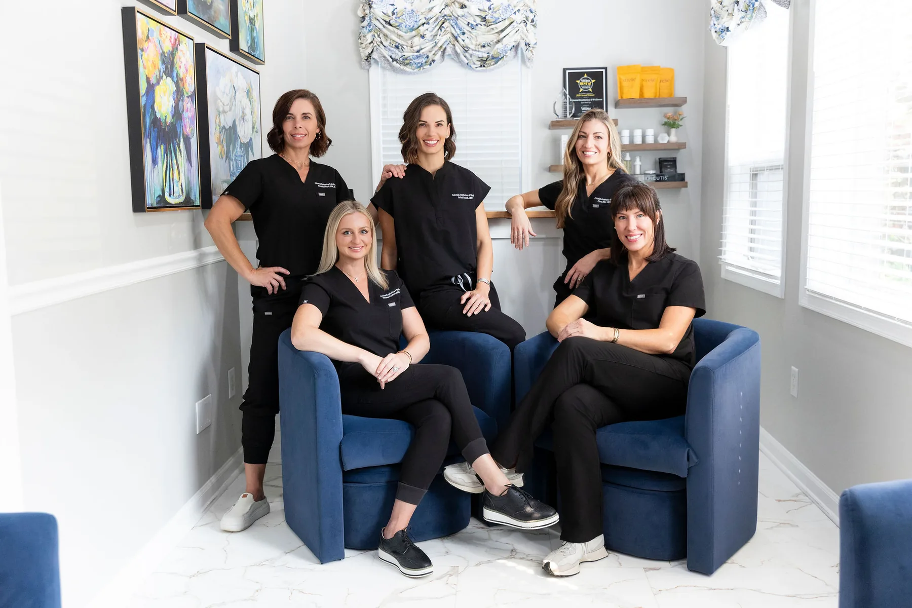 The Colonial Aesthetics & Wellness team in the waiting room of the Williamsburg practice